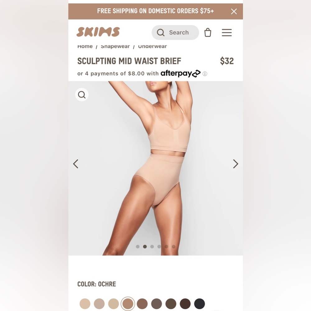 Skims mid waist control brief